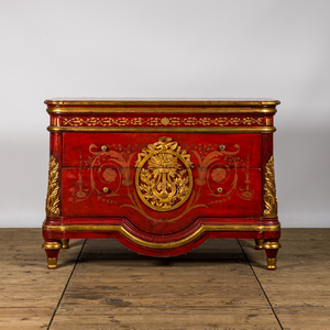A red lacquered and gilt chest of drawers, 20th C.