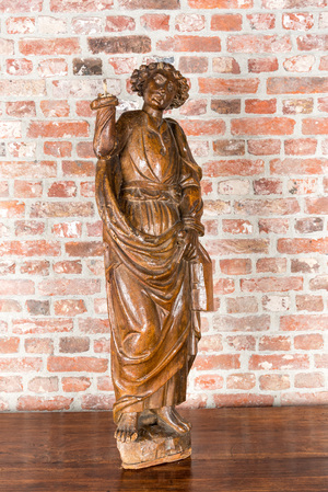 A wooden sculpture of a saint, 17th C.