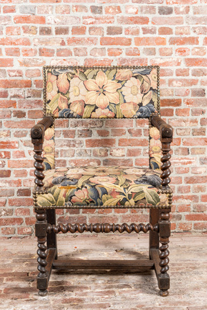 A walnut armchair with floral upholstery, 17th C.