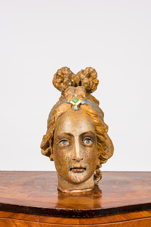 A polychrome wooden head of a female saint, 18th C.