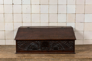 An English carved oak writing box monogrammed AW, 18th C.
