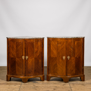 A pair of French mahogany corner cabinets with marble tops, 18/19th C.