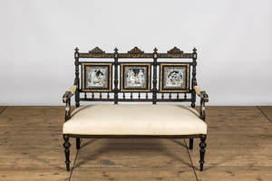 An English ebonised wooden sofa with mother-of-pearl inlaid and three Minton Waverley plaques by John Moyr Smith (1839-1912), 19th C.