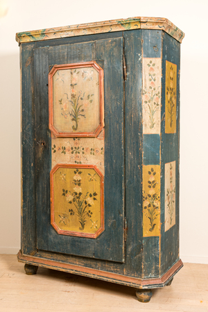 A German painted wooden one-door cupboard, 19th C.