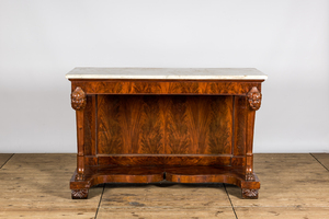 A large French mahogany console with lions' heads and marble top, 19th C.