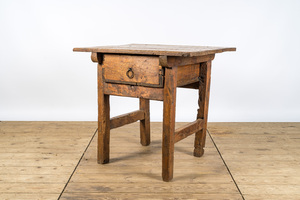 A rustic rural wooden table with drawer, 19th C.