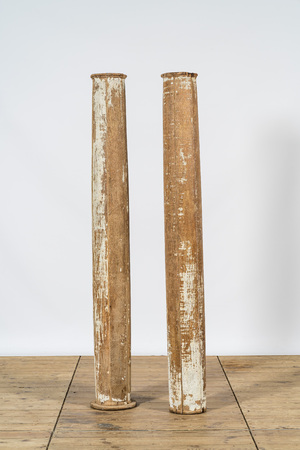A pair of partly patinated wooden columns, 19th C.