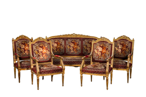 A neoclassical gilt wooden salon set comprising a sofa and four armchairs, 20th C.
