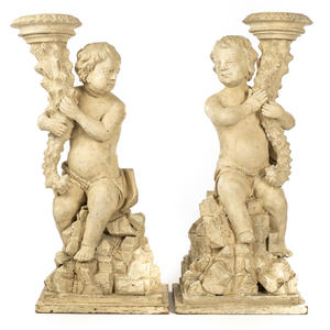 A pair of white patinated wooden putti holding a cornucopia, 18th C.