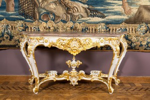 An attractive partly gilt wooden console table with marble top, Italy, 19th C.