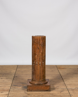 A wooden pedestal in the shape of a fluted column, 19th C.
