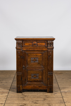 A renaissance-style oak wooden one-door cabinet, 17th C.