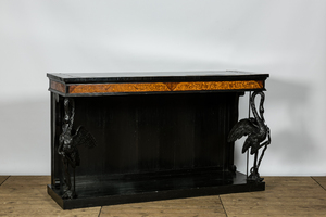 An ebonised and inlaid wooden console with swans, 19th C.