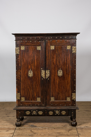 An English colonial brass mounted two-door cabinet, 19th C.