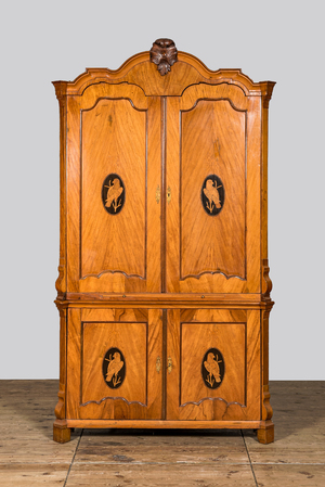 A fruit wood corner cabinet with marquetry design of parrots in medallions, last third 18th C.