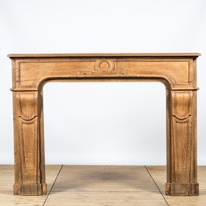 A neoclassical style oak wooden fireplace, 19th C.