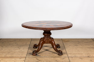 A round rosewood table on a mahogany base, 19/20th C.