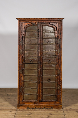An Indian metal mounted hardwooden cupboard, 20th C.