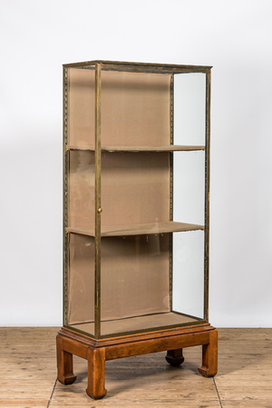 A French brass display cabinet on Asian wooden stand, 20th C.