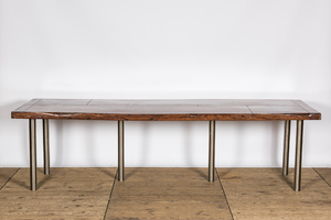 A lacquered wooden table on metal legs, 20th C.
