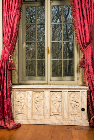 Three faux marble-painted wooden panels with saints mounted as heating frames, 19/20th C.