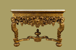 An Italian richly carved gilt wooden console with marble top, 19th C