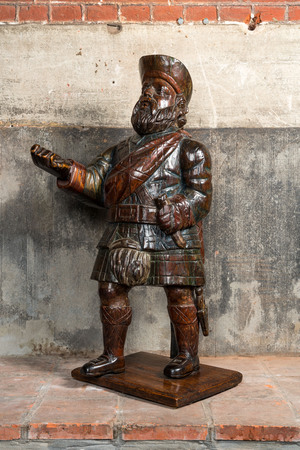 A polychrome wooden figure of a Scottish nobleman, 19th C.