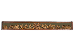 An exceptionally long carved wooden frieze with allegorical depictions of putti, 18th C.