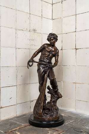 L.F. Moreau (19/20th C.): Fisherman, patinated bronze on a black marble base