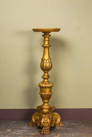 A large Italian gilt wooden pedestal with lion's feet, 19th C.