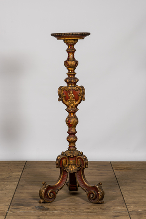 An Italian polychrome and gilt wooden church candlestick, 18th C