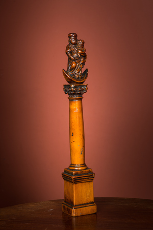 A walnut Madonna and Child on the crescent moon on a Corinthian column, 17/18th C.