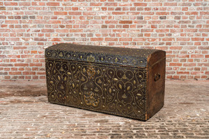 A French wooden 'bahut' trunk with leather upholstery and partly studded gilt copper mounts, 17th C.