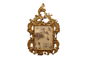 A large finely carved and gilt wooden rococo mirror, Italy, 18th C.