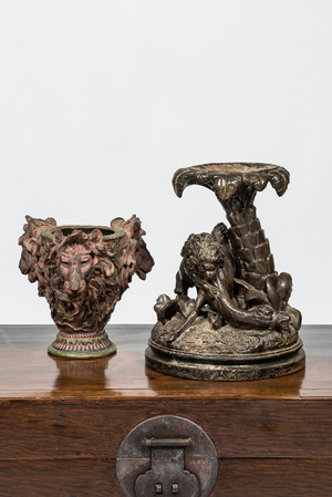 A faux bronze pottery group of a lion killing a camel and a patinated plaster jardinière with lion's heads, 19th C.