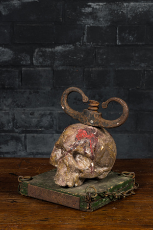 A macabre polychrome wood sculpture with a skull, 19/20th C.