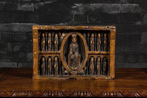 A Spanish polychrome wooden panel depicting Jesus in a medallion surrounded by the twelve apostles after the altar of Sant Pere in Ripoll, 19th C.