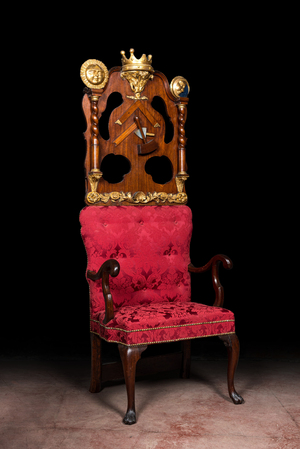 An imposing English partly gilt wooden masonic throne chair, 19th C.