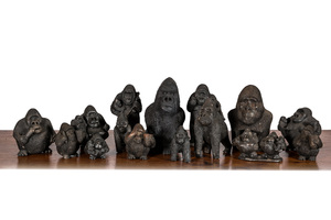 A large collection of wooden and polystone gorilla sculptures, 20th C.