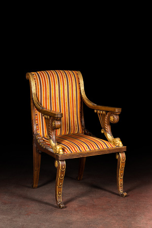 A French partly gilt wooden arm chair with ram heads, 19th C.