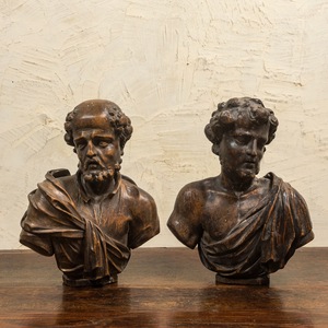 A pair of Italian walnut busts of males, 17th C.