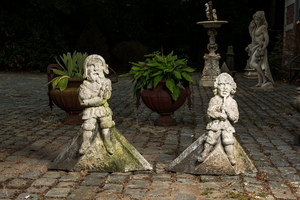 A pair of carved stone roof ornaments with historical warriors, 19th C.