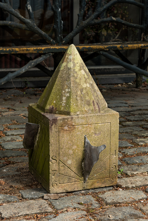 A carved stone sundial with lead indicators, 19th C.