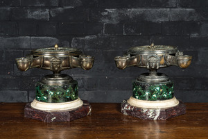 A pair of French silver-plated bronze neoclassical oil lamps on a marble and faux marbre base, 19th C.