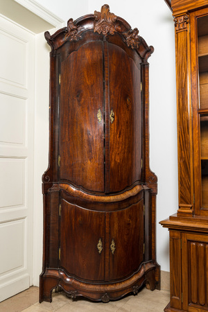 A large baroque-style four-door corner cupboard, probably Italy, 18/19th C.