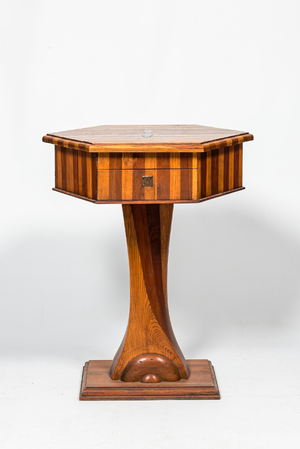 A hexagonal oak wooden and walnut work table on a central base, 19th C.