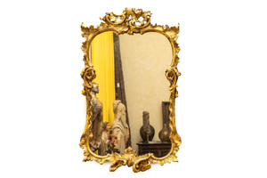 A French finely carved gilt wooden Louis XV-style mirror, 19th C.