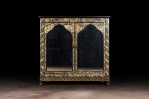 A Gothic Revival bookcase with black- and gold-painted rural scenes and foliage, 19th C.