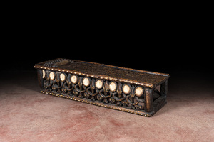A Bamileke patinated wooden richly decorated bed, Cameroon, 20th C.