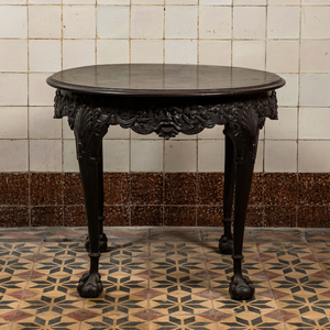 A carved and patinated wooden side table with mascarons in neobaroque-style, 19th C.